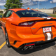 Illustration for article titled Someone Thought This Cleveland Browns-Themed Kia Stinger GTS Was A Good Idea